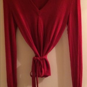 A red Moda International sweater